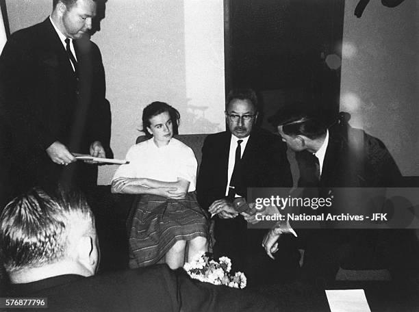 Marina Oswald, the wife of Lee Harvey Oswald, sits between James Howard and Peter Gregory as Charles Kunkel asks a question during her interview...