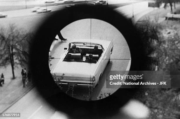 View through a gun sight from the Texas School Book Depository is part of a reenactment of the Kennedy assassination. This evidence was submitted to...