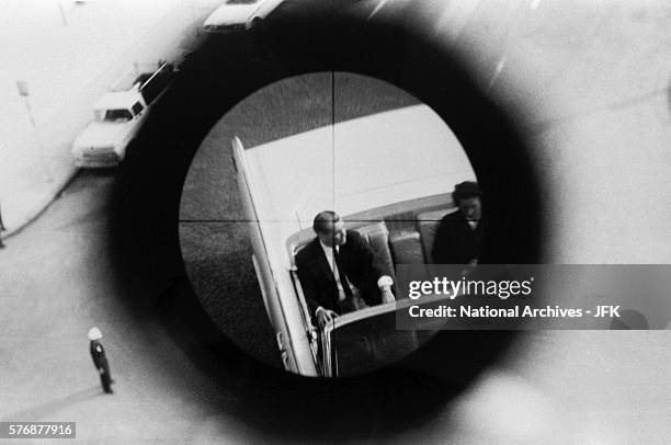 View through a gun sight from the Texas School Book Depository is part of a reenactment of the Kennedy assassination. This evidence was submitted to...