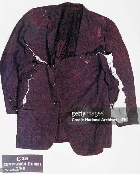 The front of the jacket worn by President Kennedy on day of his assassination. It was cut in the hospital. A bullet hole is visible on the right...