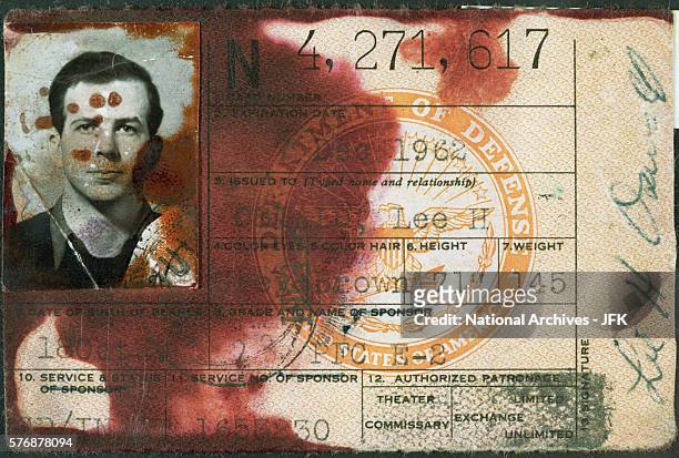Fingerprinting fluid stains the military identification card of Lee Harvey Oswald. The card was found in Oswald's wallet on the day of his arrest in...