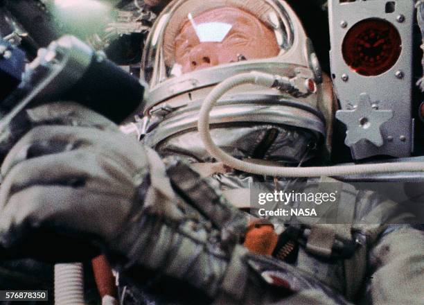 Astronaut John Glenn, inside the Mercury-Atlas 6 Friendship 7 spacecraft during his historic mission to orbit the earth. This image was taken by a...