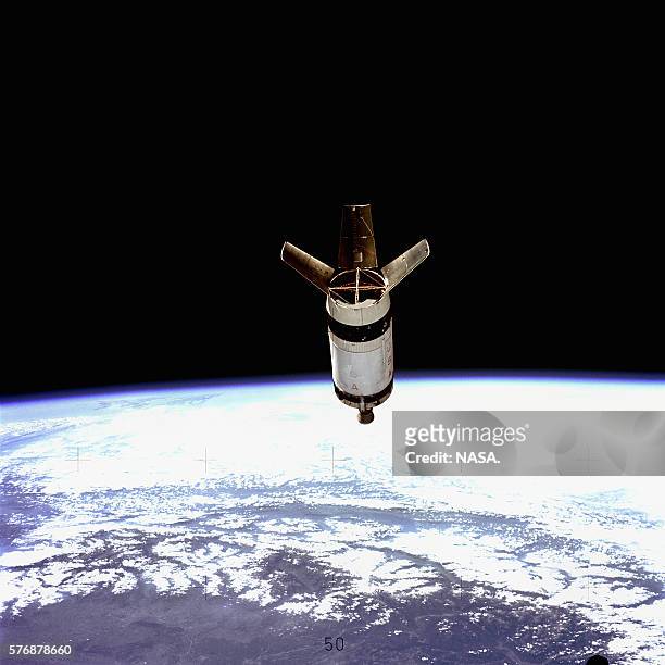 Spent S-IVb rocket floats in Earth orbit, after delivering astronauts into orbit. Later, the Apollo command and service modules delivered the...