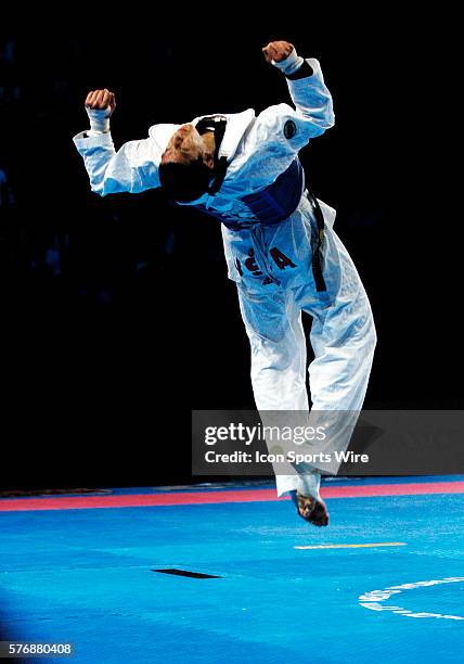 Mark Lopez celebrates winning the gold medal in the Mens under 67 Kg class at the World Taekwondo Championships in Madrid Spain, April 17, 2005. |...