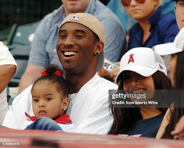 Kobe Bryant of the Los Angeles Lakers with his family during New York Yankees game against the Los Angeles Angels at Angel Stadium in Anaheim, CA.