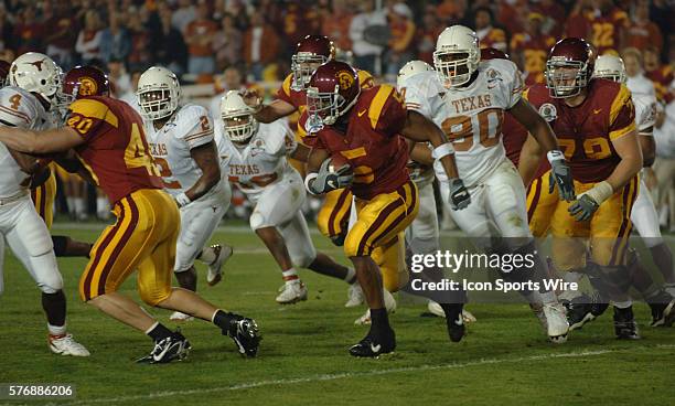 USCs Reggie Bush trys to find a hole in Texas defense during the USC Trojans game versus Texas Longhorns in the Rose bowl game and BCS National...