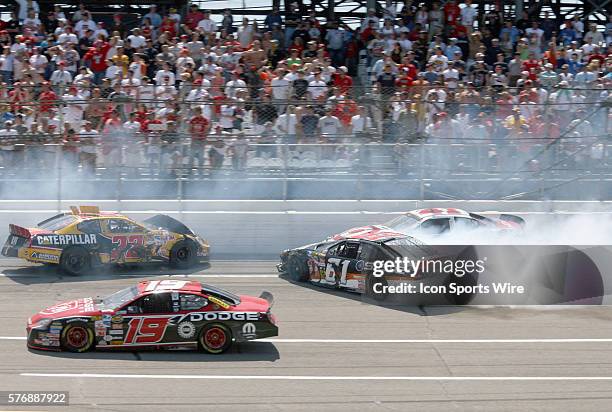 Dave Blaney, Reed Sorenson and Kevin Lepage crash as Jeremy Mayfield races past during the Aarons 499 NASCAR Nextel Cup series race at Talladega...