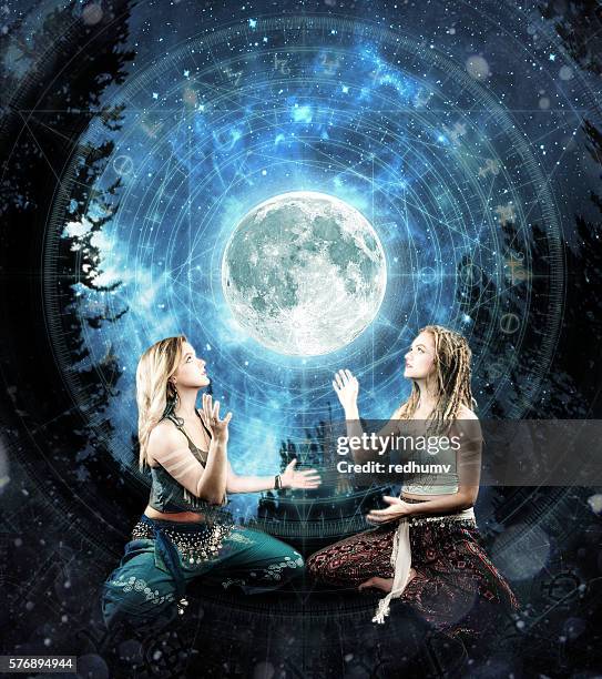 two beautiful young women digital shamanism concept - shaman stock pictures, royalty-free photos & images