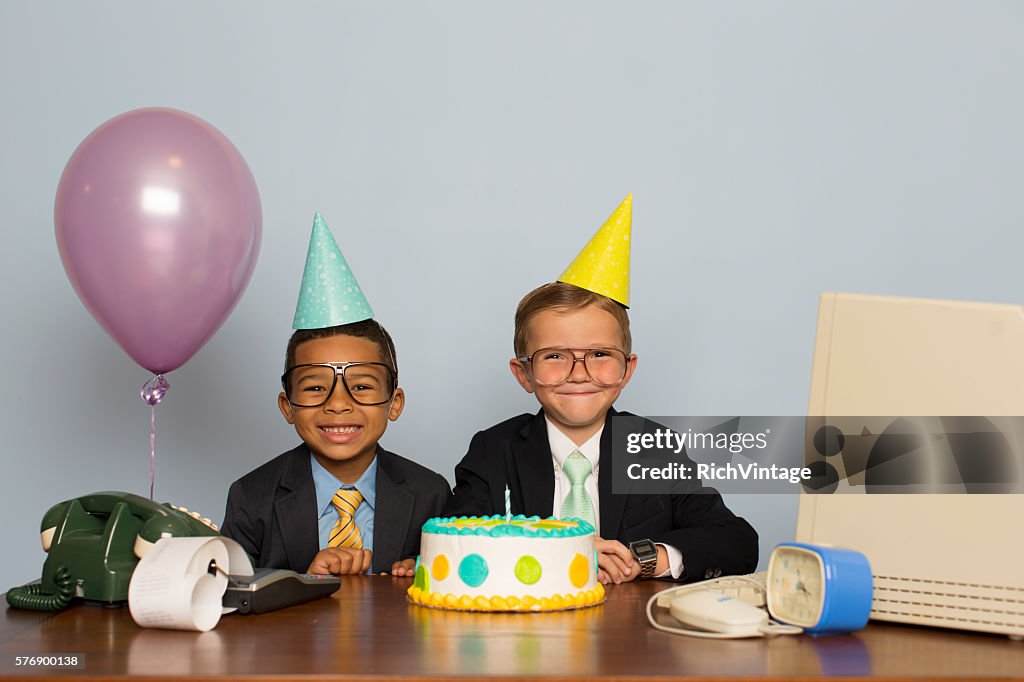 Young Boy Businessmen Celebrate with Business Birthday Cake