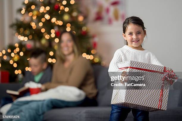 holding a big christmas present - big fat white women 個照片及圖片檔