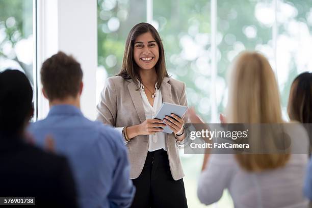 clapping after a presentation - confident indian woman stock pictures, royalty-free photos & images