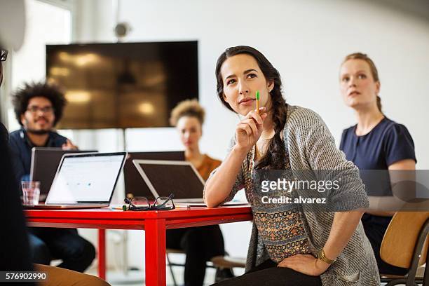 woman with coworkers in conference room - fritidskläder bildbanksfoton och bilder
