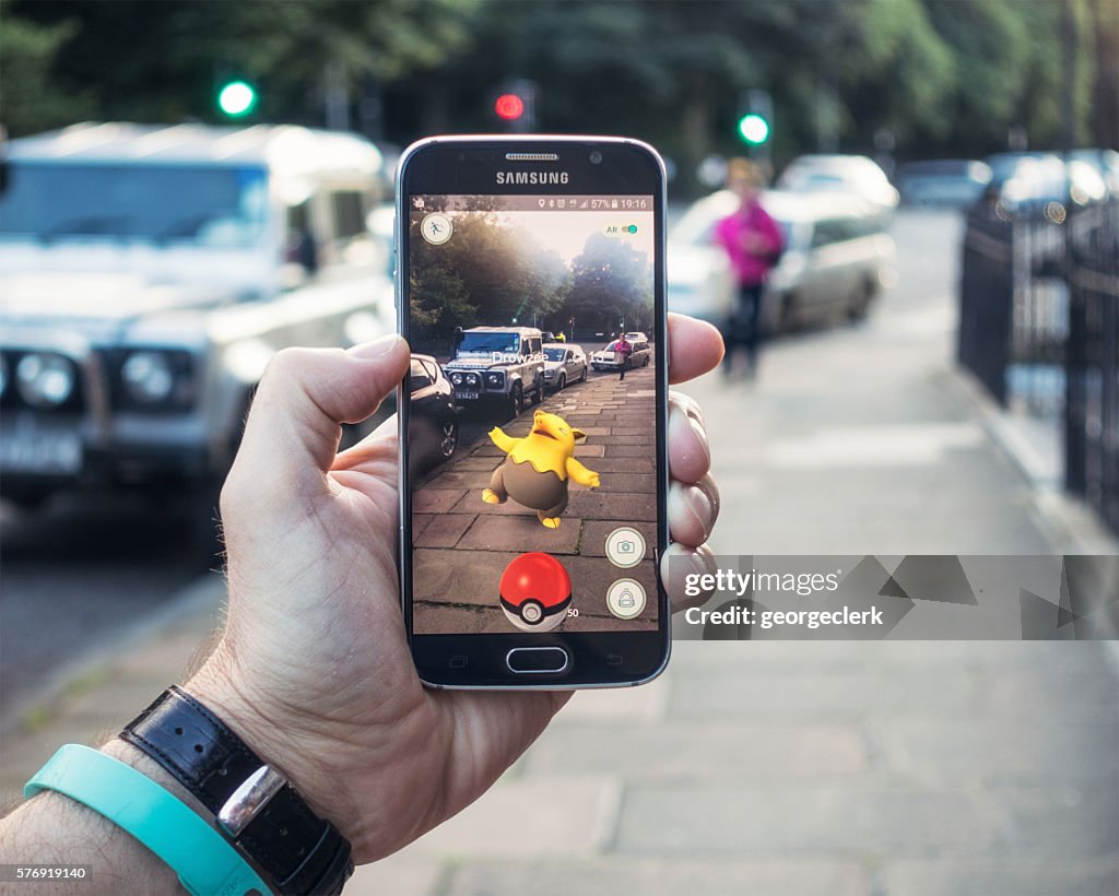 Playing Pokemon Go on the street