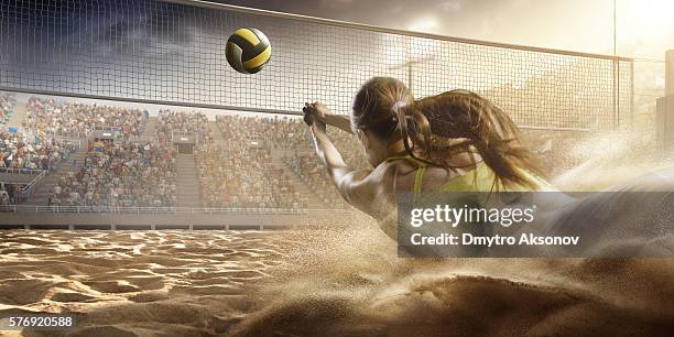 volleyball: female player in action - volleying stock pictures, royalty-free photos & images