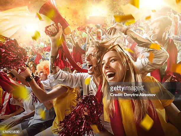 sport fans: group of cheering fans - voetbalcompetitie sportevenement stockfoto's en -beelden