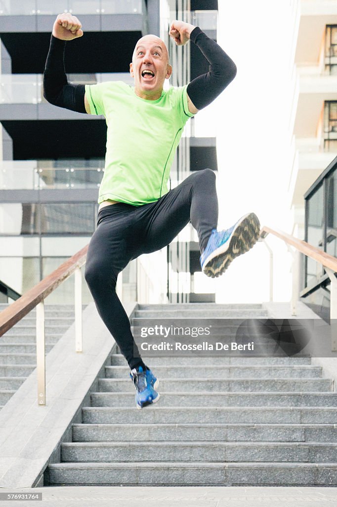 Cheerful Man Running And Jumping