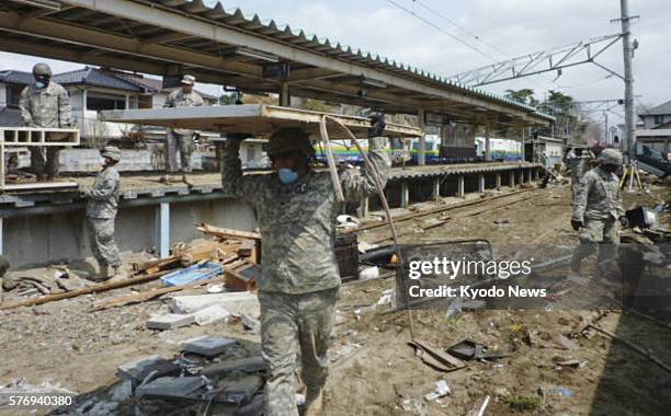 Japan - U.S. Army soldiers stationed in Japan are engaged in recovery work at Nobiru Station on the JR Senseki Line in Higashimatsushima, Miyagi...