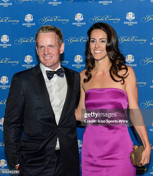 Luke Donald of Europe and his wife Diane Donald pose for a photo on the red carpet during the 39th Ryder Cup Gala, at the Akoo Theater in Rosemont,...