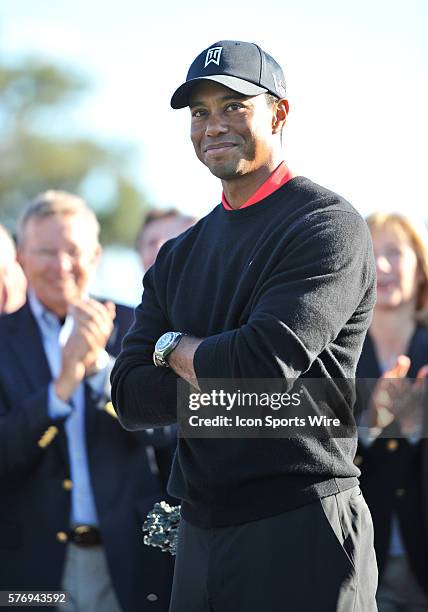 Tiger Woods smiles before receiving the Farmers Insurance trophy during the Final Round of the Farmers Insurance Open at Torrey Pines Golf Course in...