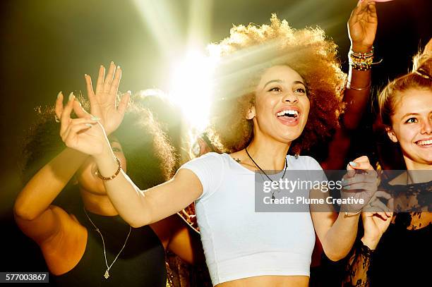 woman laughing and having fun at a party. - three people dancing stock pictures, royalty-free photos & images