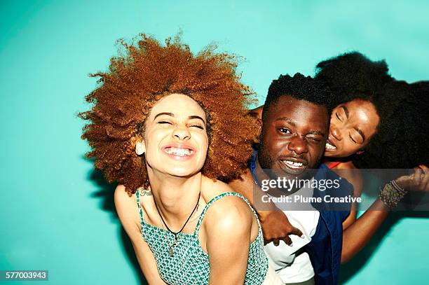 friends laughing and having fun. - three people smiling stock pictures, royalty-free photos & images