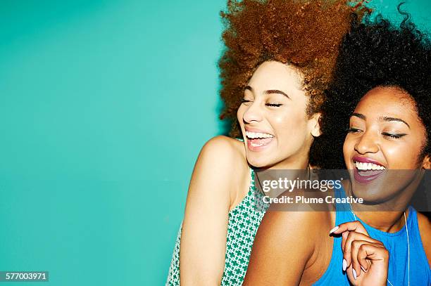 two friends laughing. - tank top stock pictures, royalty-free photos & images