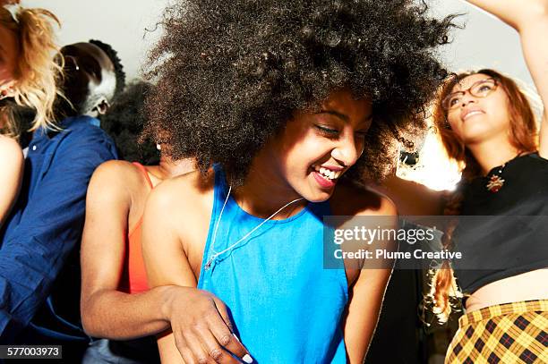 woman laughing, having fun and dancing. - collier et femme photos et images de collection