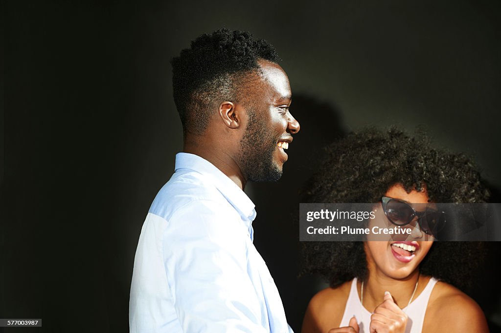 Man laughing at party.