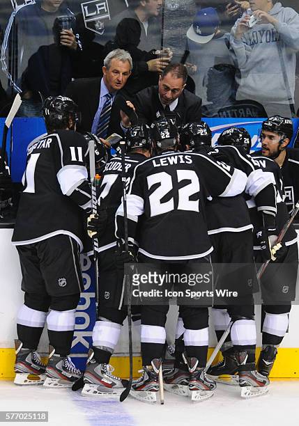 Kings coach Darryl Sutter talks with his players during a time out during game 1 of the NHL Western Conference Semifinal between the San Jose Sharks...