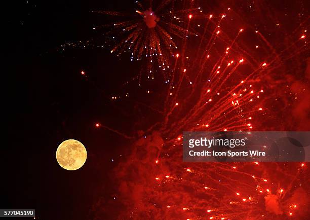 The full moon is framed by fireworks at Comerica Park in Detroit following the Tiger's 6-0 win over the Minnesota Twins, Friday night behind a...