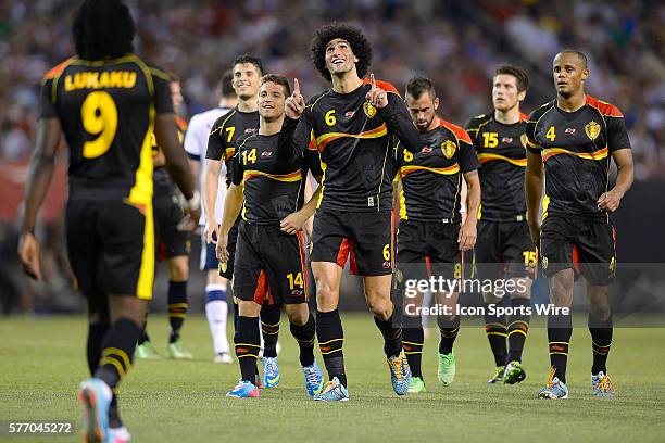 Belgium midfielder Marouane Fellaini congratulates teammate Belgium forward Romelu Lukaku after scoring a goal in action during a friendly match...