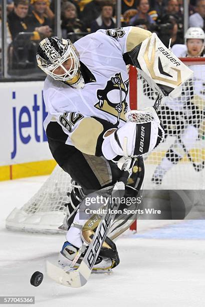 Pittsburgh Penguins goalie Tomas Vokoun clears the puck out of his zone during the Penguins game against the Bruins at TD Garden Boston, MA