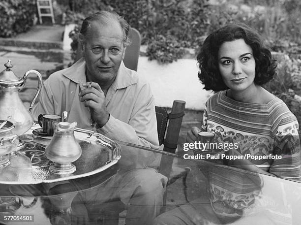 Actors and spouses Curd Jurgens and Simone Bucheron seated together on the terrace of their villa in Saint Jean-Cap-Ferrat in France, July 29th 1959.