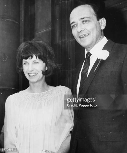 Actress Betsy Blair and her husband, filmmaker Karel Reisz, pictured following their wedding ceremony outside Paddington Registry Office, London,...