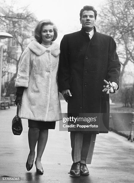 Actors Tom Tryon and Carol Lynley, stars of Otto Preminger's film 'The Cardinal', walk together in the Embankment Gardens prior to the premiere of...