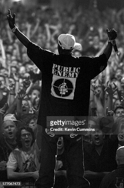 View of the audience shouting and cheering to Flavor Flav of Public Enemy as they perform on the Don't Look Back tour, Brixton Academy, London,...