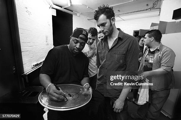 Chuck D of Public Enemy signs autographs backstage on the Don't Look Back tour, The Junction, Cambridge, United Kingdom, 24 May 2008.