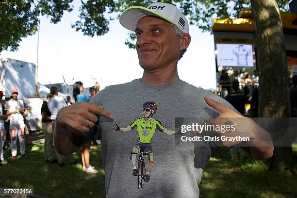 Team owner Oleg Tinkov points to his shirt with Peter Sagan of Slovakia riding for Tinkoff after stage 16 of the 2016 Le Tour de France, a 209km...