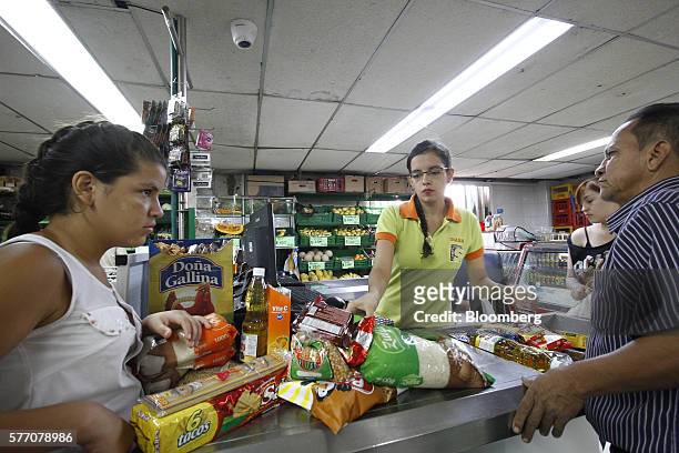 Venezuelans shop for groceries at a supermarket in Cucuta, Colombia, on Sunday, July 17, 2016. For only the third time in a year, Venezuela's...
