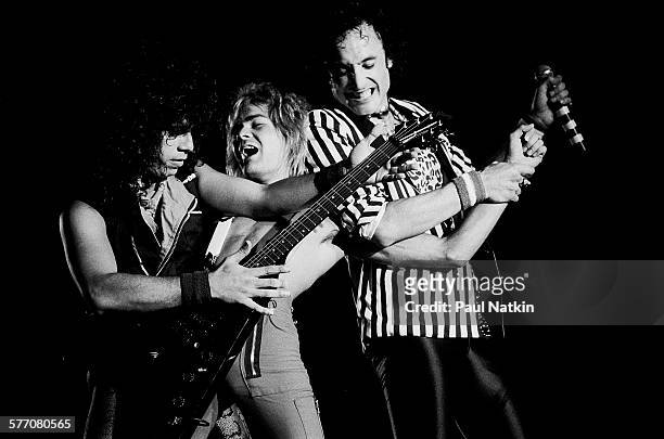 From left, Rock musicians Frankie Banali, Carlos Cavazo, and Kevin DuBrow , all of the band Quiet Riot, perform onstage, Des Moines, Iowa, August 20,...