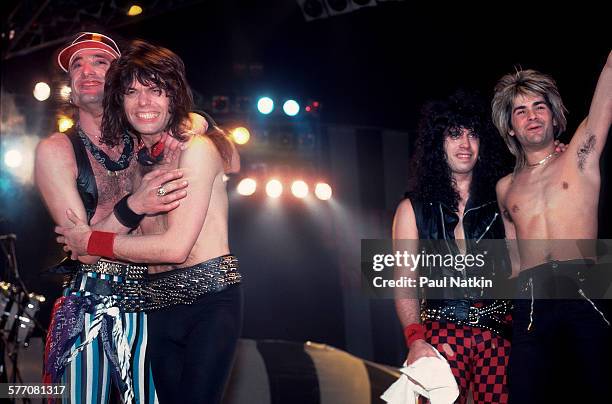 From left, Rock musicians Kevin DuBrow , Rudy Sarzo, Frankie Banali, and Carlos Cavazo, all of the band Quiet Riot, take a bow after a performance,...