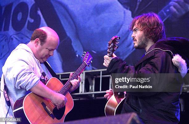 American comedians, actors, and musicians Kyle Gass and Jack Black, both of the band Tenacious D, perform onstage, Chicago, Illinois, May 18, 2002.
