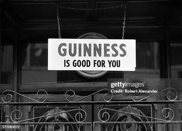 Sign hanging in front of a pub in Kilkenny, Ireland, proclaims that 'Guinness is Good for You.' Guinness is an Irish dry stout produced by Diageo, a...