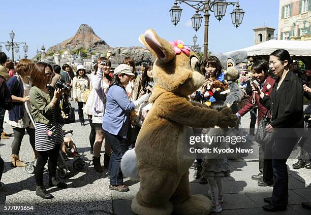 Japan - Visitors enjoy themselves at Tokyo DisneySea Park in Urayasu, Chiba Prefecture, on April 28 as the park reopened the same day ahead of the...