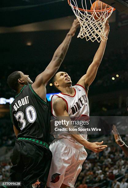 Brandon Roy of the Portland Trail Blazers lays the ball up against Mark Blount of the Minnesota Timberwolves during the second half of Portland's...