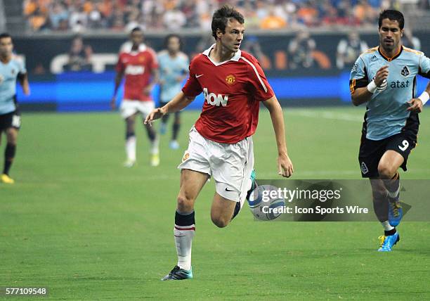 Jonny Evans of Manchester united dribbles the ball down the field in the second period of the MLS All-Star game. Manchester United defeated the MLS...