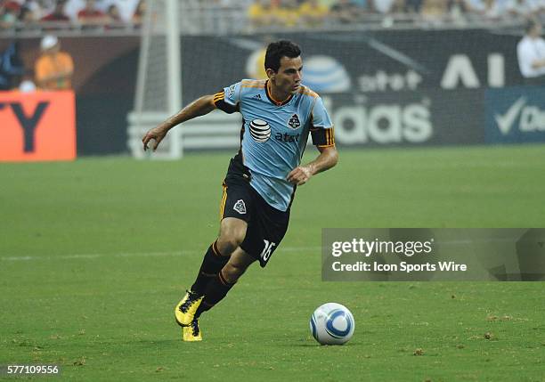 Marco Pappa of the MLS All-Stars dribbles the ball down the field against Manchester United in the MLS All-Star game. Manchester United defeated the...