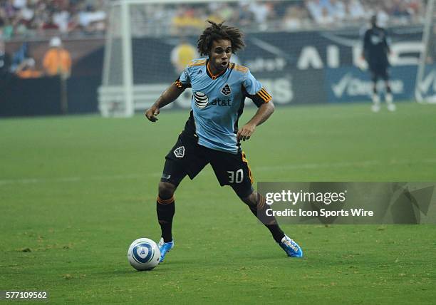 Kevin Alston of the MLS All-Stars looks for an open pass as he protects the ball from Manchester United defenders during the MLS All-Star game....