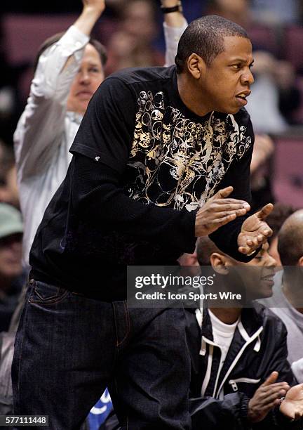 Jay-Z cheers as the Nets play Toronto in the first half during the New Jersey Nets 102-89 victory over the Toronto Raptors in game three of the East...