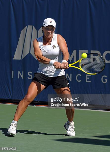 Svetlana Kuznetsova hits a return shot during a match against Agnieszka Radwanska during the finals of the Mercury Insurance Open played at the La...